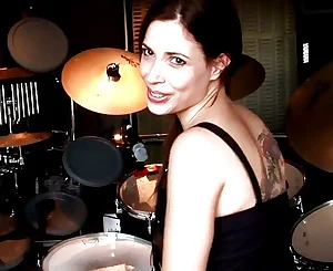 G/g Nina with drums demonstrating her flawless figure